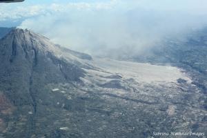 Sinabung surrounded by several villages covered by its volcano dust